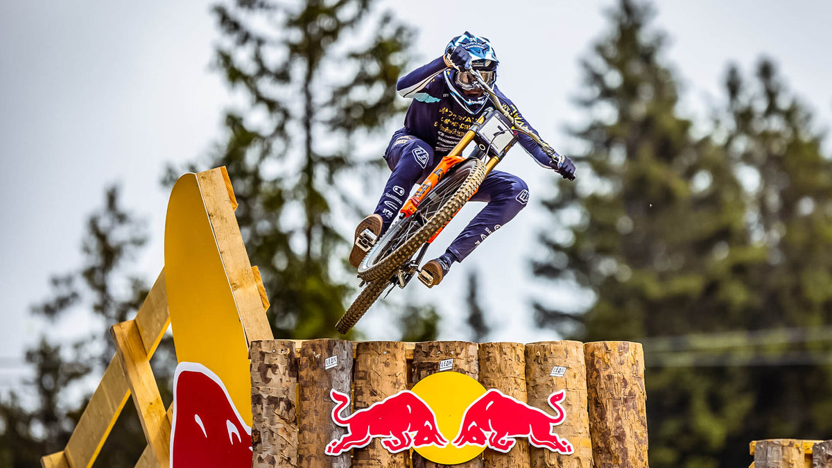 Troy Lee Designs downhill rider going over a ramp